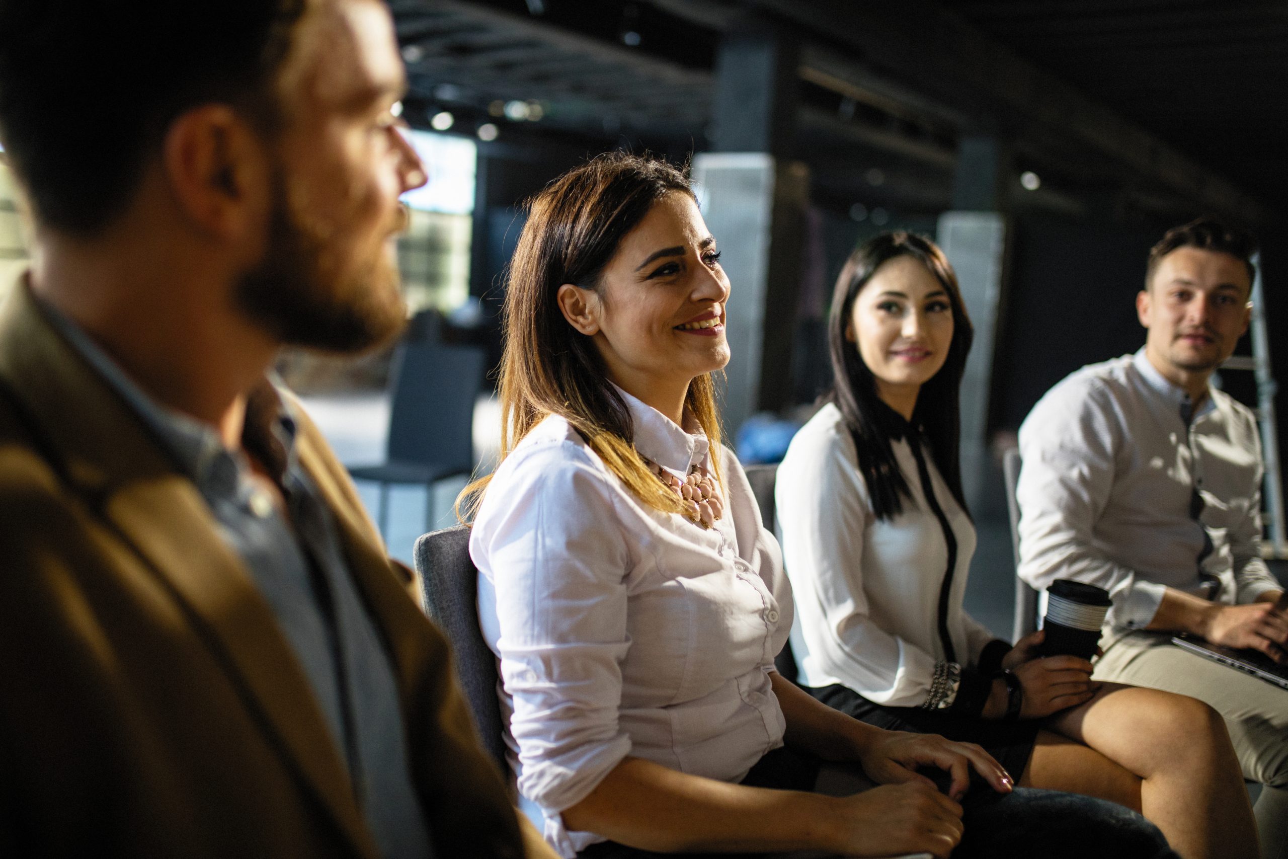 Group of people sitting in a circle and talking